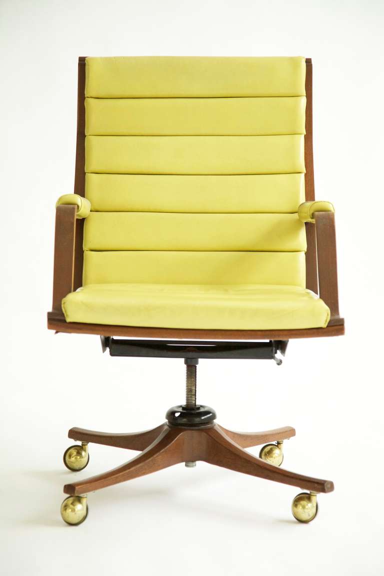 Wormley for Dunbar, channel back desk chair. 
Original pea green leather. Tilts, swivels. Adjustable on casters.