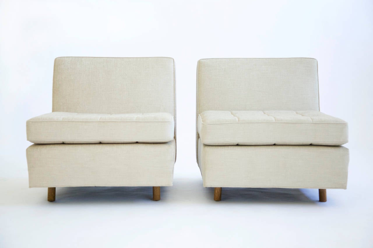 Probber Inc. pair of loose cushion lounges from the Nuclear-Sert Group.
Solid mahogany legs recessed for floating effect, reupholstered with Great Plains cotton-blend.
Seat dimension: 22