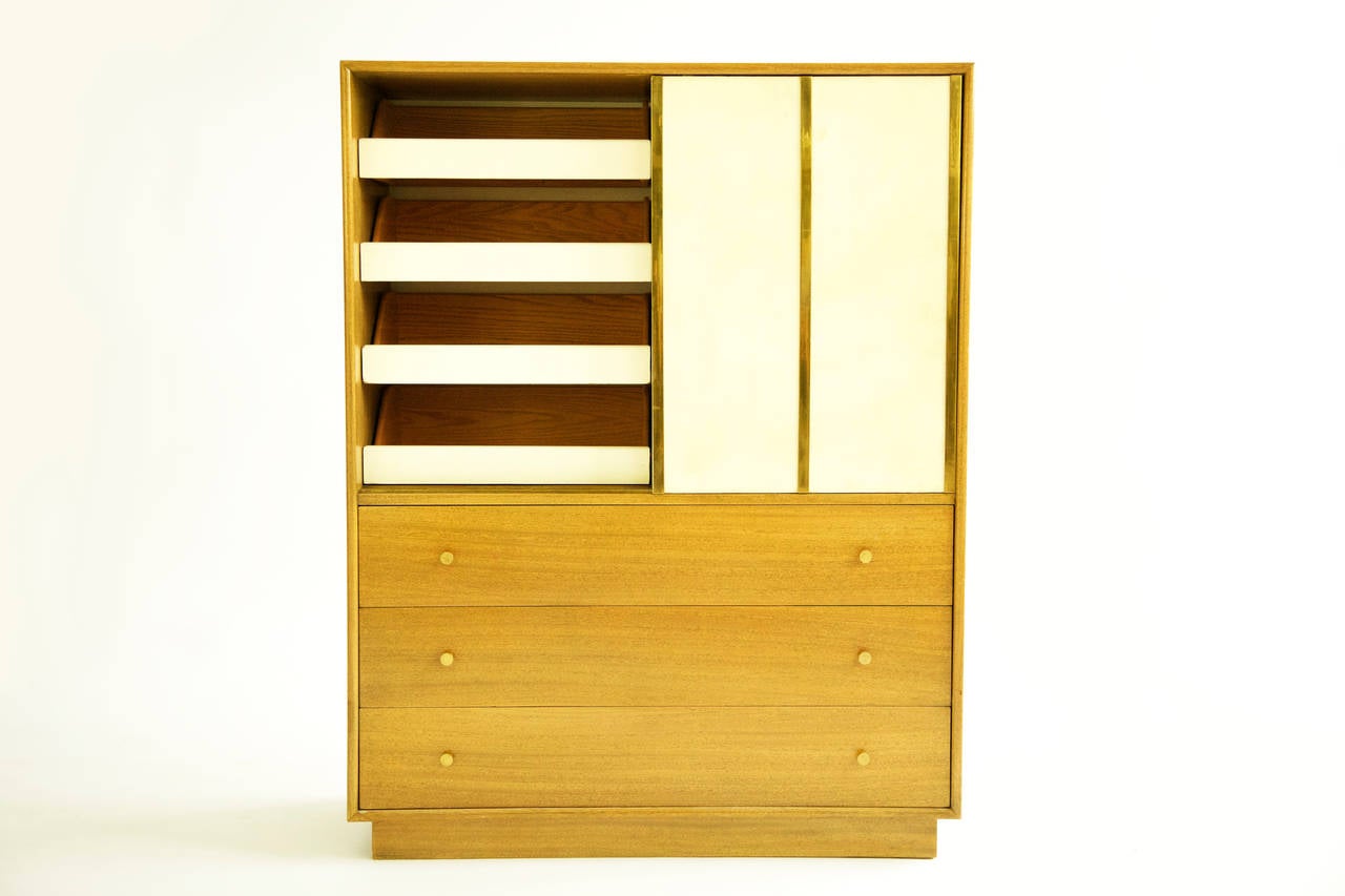 Probber; leather-brass strip sliding doors over three drawers 
