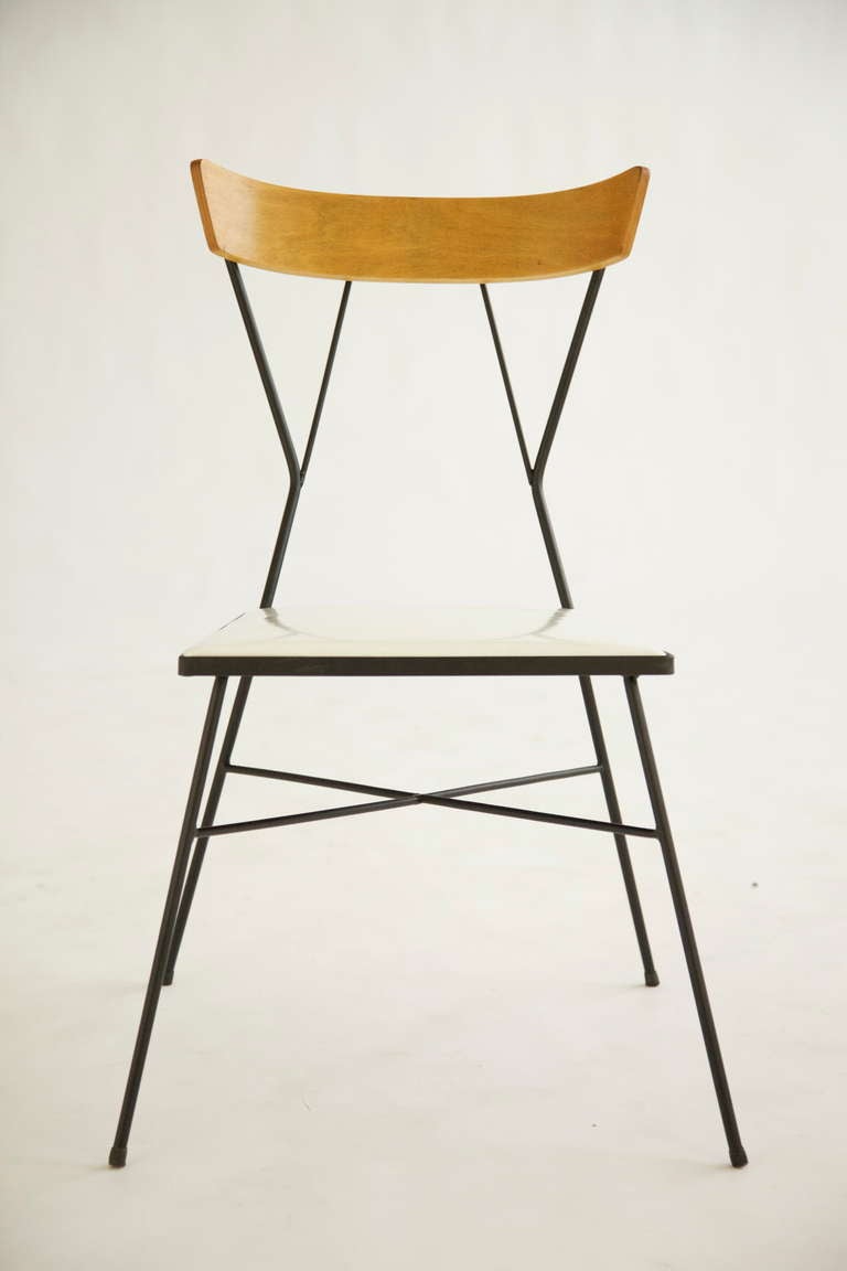 Paul McCobb design produced by Arbuck circa 1953-1955
Seats recovered in vinyl.

Chair measures: 20.5 w x 20 d x 33 h inches.