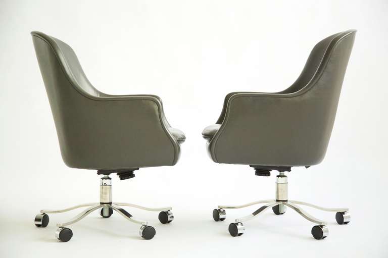 ZOGROPHOS-High Back Bucket Chairs. Grey leather, loose cushions on 5 Star chrome plated base.
Tilt ,swivel ,adjustable, tilt lock.