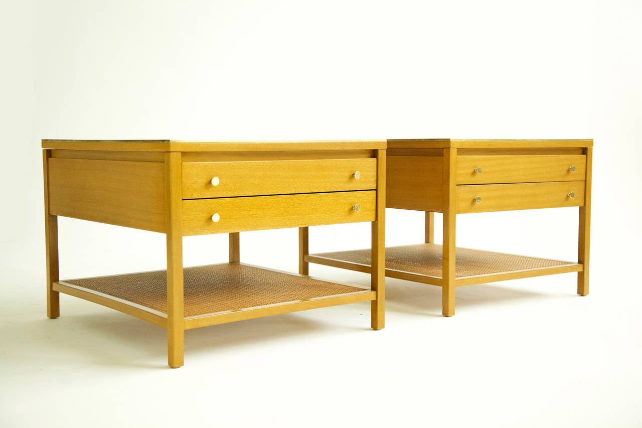 Paul McCobb for Calvin of Grand Rapids, The Irwin Collection, pair of end tables/ nightstands- two-drawer units with brass perimeter edges and brass pulls, caned shelf's.
metal tags signed [Calvin Grand Rapids 