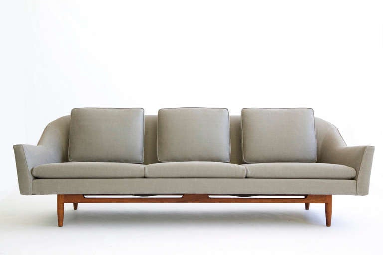 Risom for Risom Design Inc. Curved Back Sofa Model 2516
Showing three separate back cushions, contoured arms and recessed walnut base.
Reupholstered with great Plains wool fabric.
