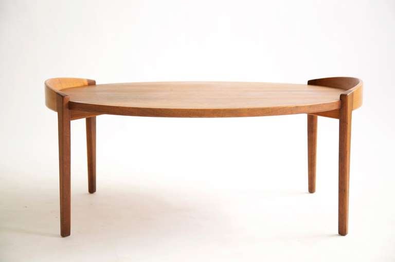 Risom Design Inc. 4035 round low table.
Walnut top with teak legs, top drops down leaving raised rim curved detail edge to keep items from falling.