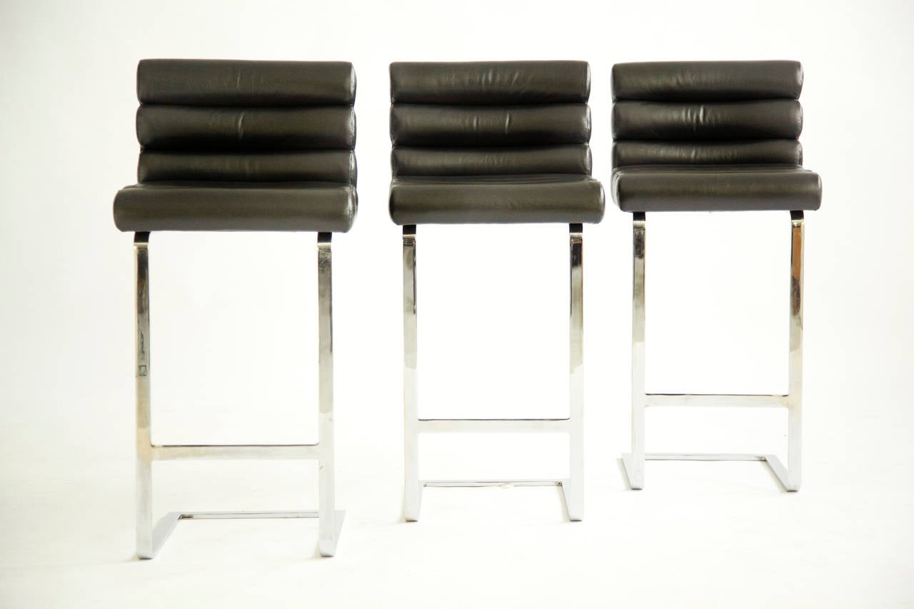 Bar stools, attr. to Pace, cantilever chrome-plated bases with leather channel back and seat. Seats have a slight curved back for added comfort.
Reupholstered with Spinneybeck leather.