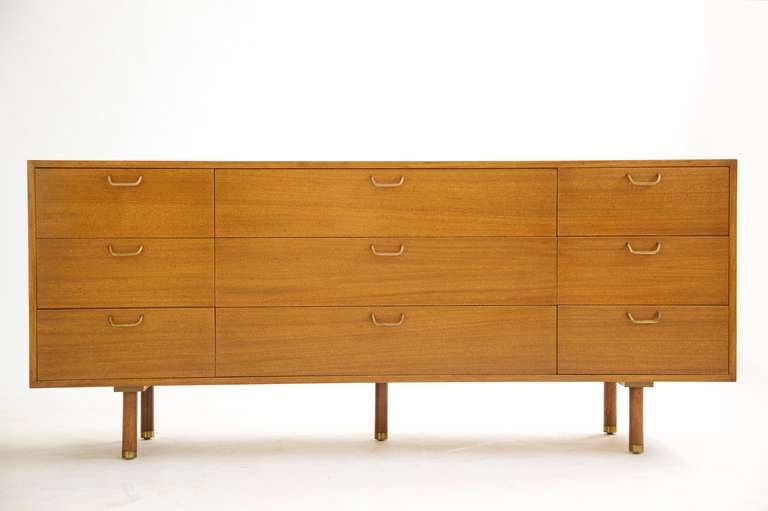 Probber for Probber Inc. nine drawer dresser
features brass pulls and brass details on legs.
Mahogany Case.