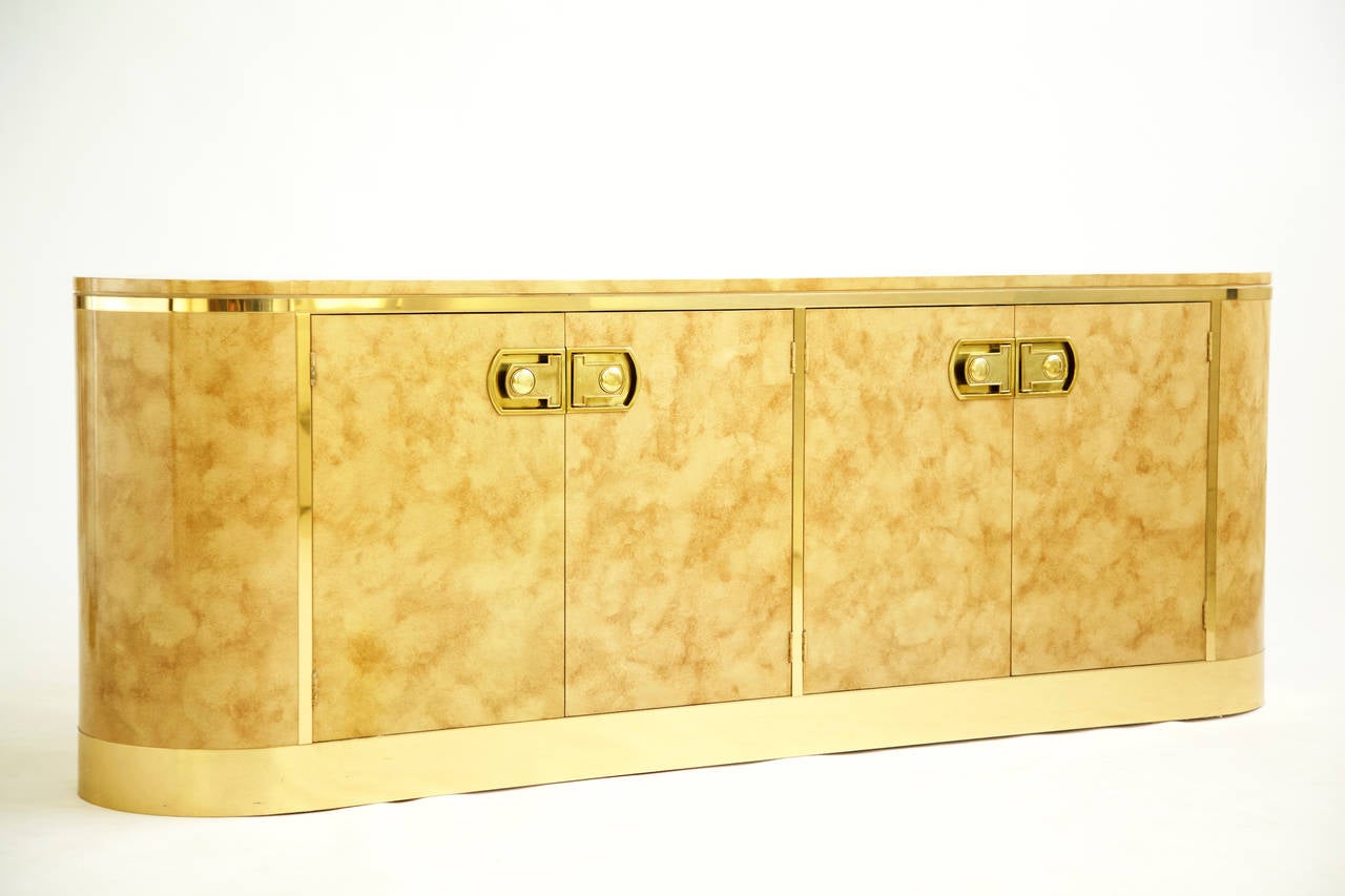 Mastercraft credenza, four-door hand-painted credenza, bronze accents throughout, decorative brass details: Pulls and plinth. 
Case concealing two storage areas adjustable/removable shelf on right side and four drawers with cut-out pulls on left