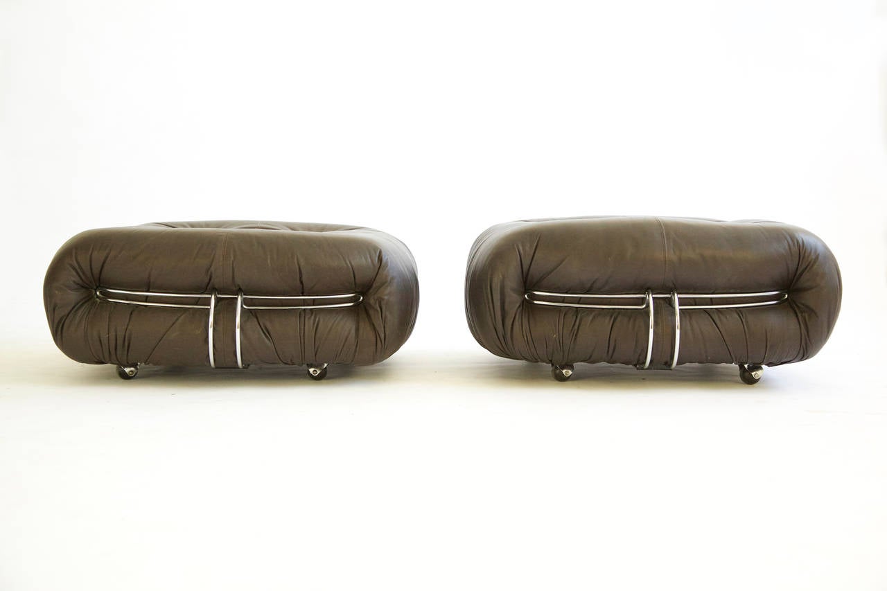 Afra and Tobia Scarpa, Soriana Rolling Ottomans
Chocolate brown leather with metal bracing.
Signed with decal manufacturer's and distributor's labels to underside: [Cassina Made in Italy] and [Made in Italy for AI Atelier International Limited]