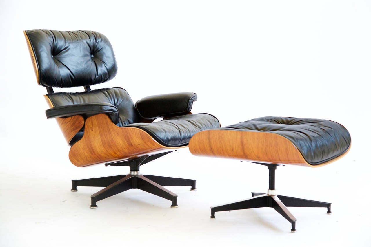 Eames for Herman Miller, 670 lounge chair and 671 ottoman, ottoman measures: 25.75 w x 22 d x 17 h inches
Lighter wood with figured graining.