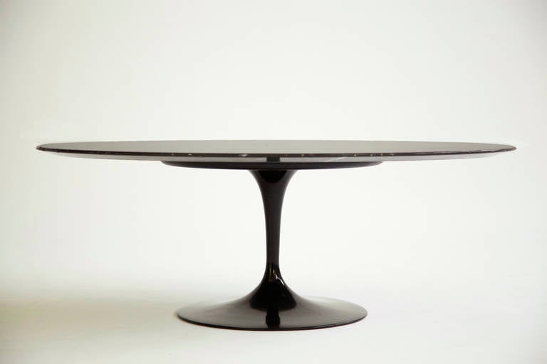 Saarinen for Knoll Tulip dining table. Metal base with negro marquina marble.
[Label Knoll international Italy].