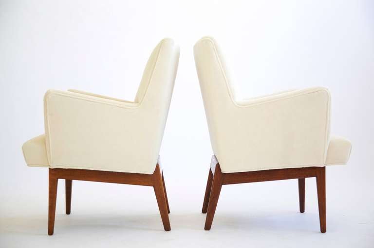 Risom for Risom Design Inc. Pair of upholstered Arm Chairs.
Solid walnut spayed legs with classic Risom architectural notched base.
outside arm height 26.5
