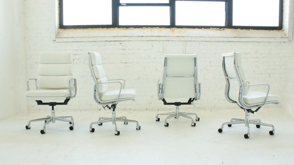 Eames for Herman Miller Soft Pad Group - Executive chairs. An extension of the Aluminum Group chairs designed in 1958 for the Irwin Miller home, the Soft Pad Group repeats the structure of the earlier chairs, adding cushions to the seat and back.