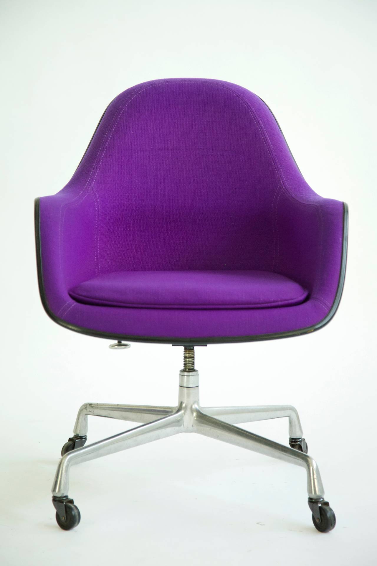 Black shell upholstered in original Girard hopsak. Product features adjustable seat height of 17" at its lowest and 19" at its highest, with tilt-swivel base. Dated November 1st, 1973. New upholstery recommended.