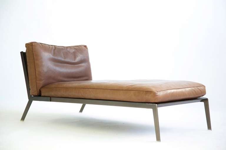 Citterio for Flexform Happy Chaise Lounge:
Frame satined in bronze metal, seat in metal covered with leather and seat cushion in dacron. Backrest metal frame and woven leather cord. Seat cushion leather down-filled with a resilient inner core.