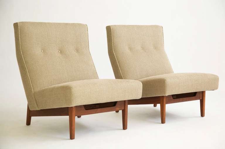 Risom for Risom Design Inc. Model 2215.  Pair of low armless chairs with walnut base.  Restoration process; Stripped down to bare frames and built up by hand with new high quality foam for years of comfort, upholstered with Great Plains Fabrics.