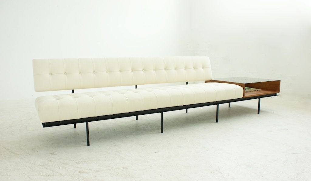 FLORENCE KNOLL<br />
Rare Florence Knoll Sofa Model 575<br />
Square tubular steel base with black finish. Walnut end table with glass top. Reupholstered in Knoll Cato.<br />
Size of case 30 X 30 height 7