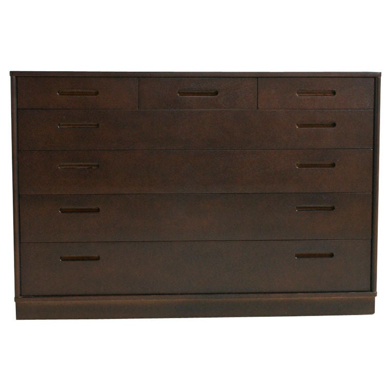 Wormley for dunbar, Pair of Seven drawer dressers /cabinets, with leather wrapped plinth bases and mahogany wood.
