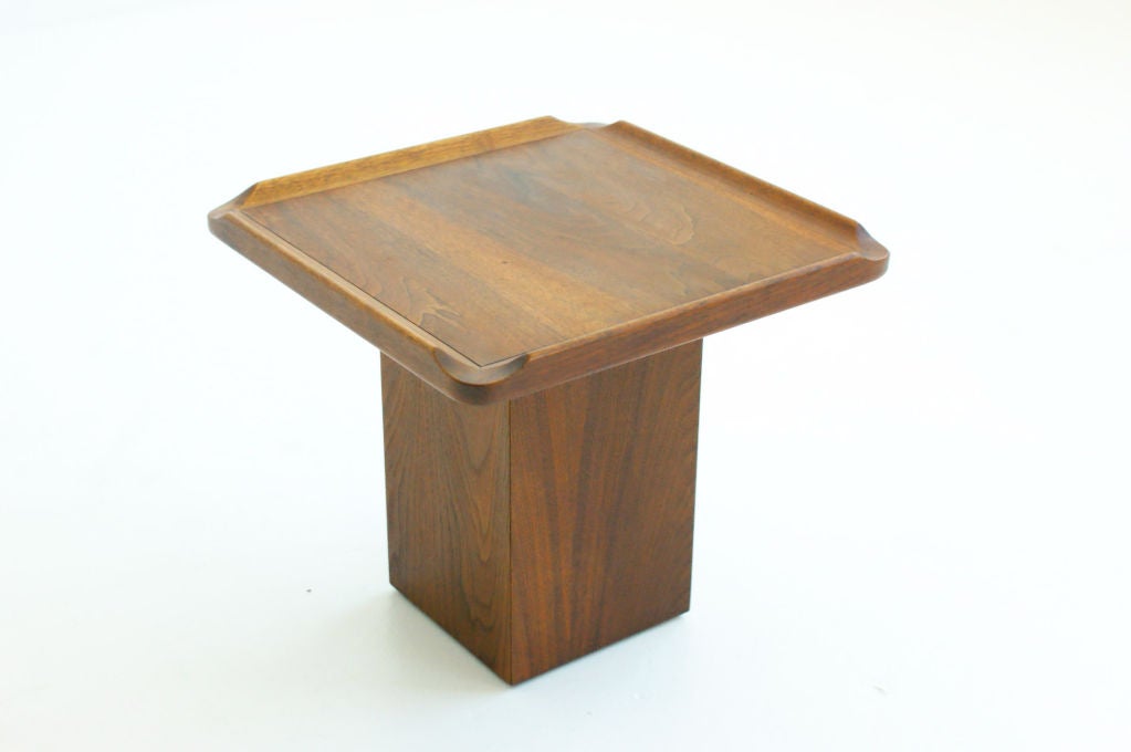 Pedestal end table or occasional table, featuring cut-out corners.