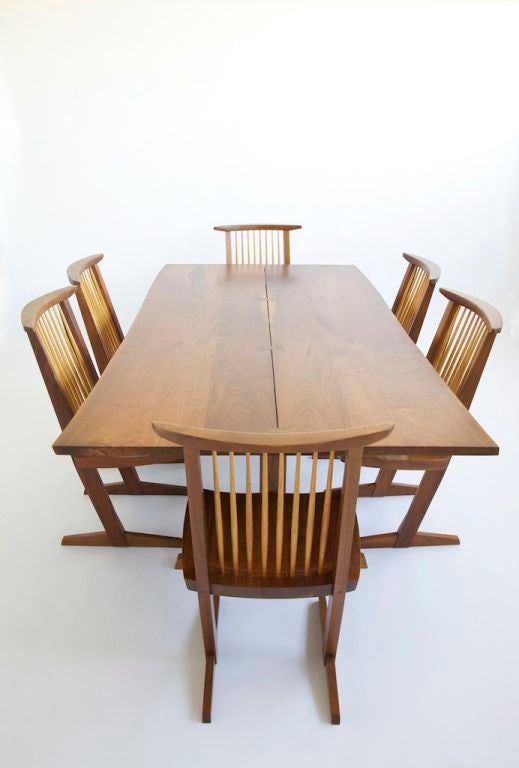 Nakashima Studio Dinning Suite. This Suite consist of a Free Edge Trestle Dinning Table: Which consists of eight book-matched solid boards, with 3 rosewood butterfly joints,  The top is not screwed in like most, it's fits precisely to the base and