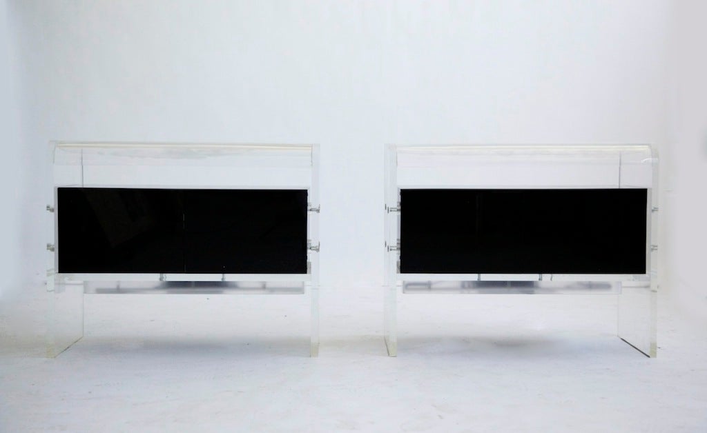 Cases have Lucite with plastic doors and light source underside
