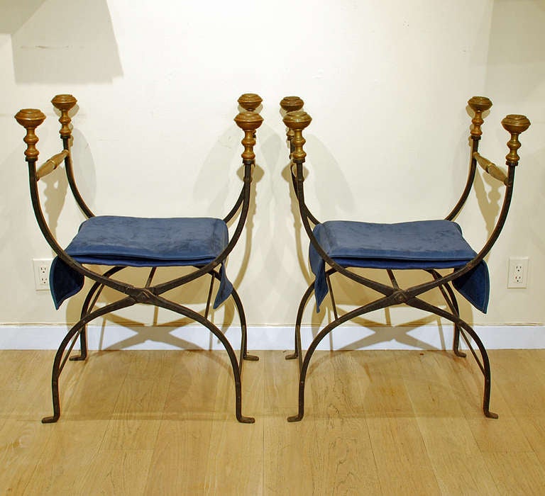 A pair of good 19th century folding Savonarola chairs with X shaped folding frame and original brass finials.  Modern royal blue leather seats. Italy. Circa 1850.

Dimensions: Seat height: 20 inches. Finial height 36 inches. Width 25 inches. Depth