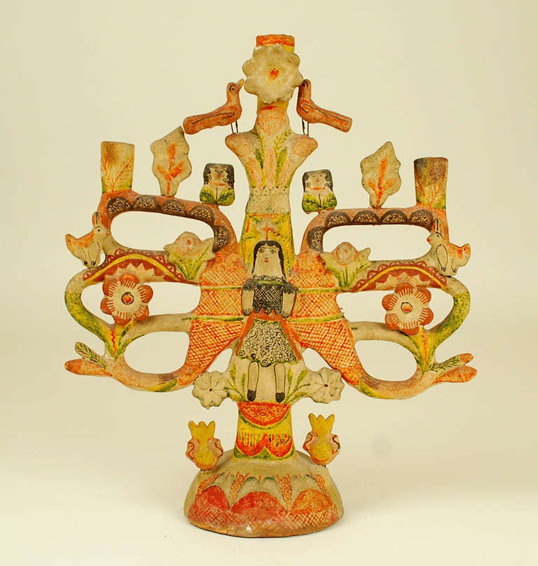 A large and impressive vintage Mexican tree of life candelabrum with the Archangel Gabriel surrounded by birds, rabbits and colorful flower blossoms. Overall with a richly colored palette and good surface patina. Attributed to one of Mexico's great