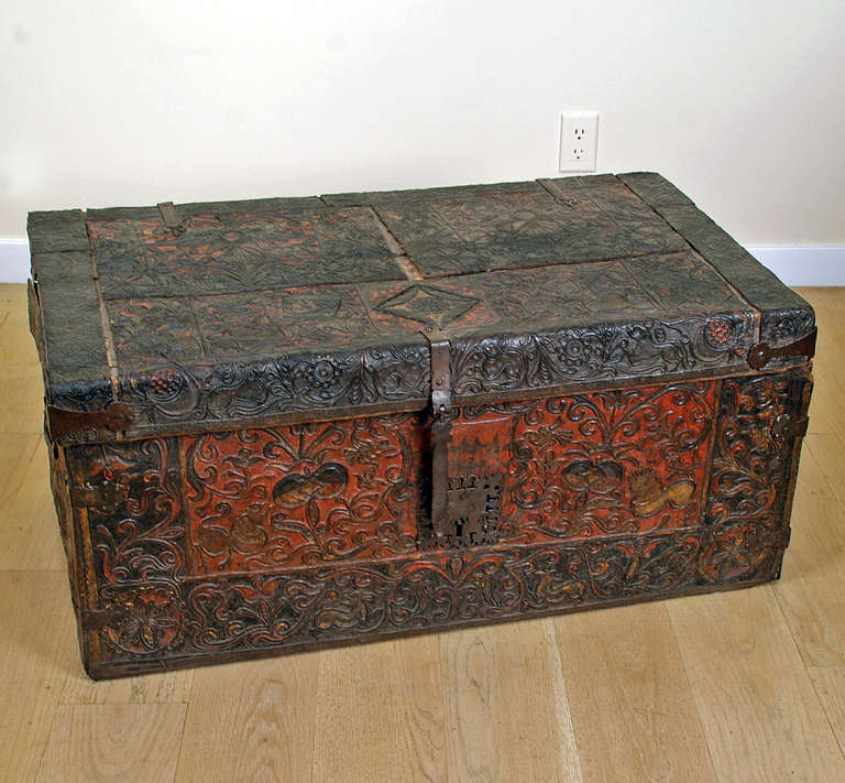 A superb 17th century Spanish colonial leather 'baul' with beautiful hand tooled and embossed lions, birds, double headed hapsburg eagles and foliate motifs throughout. Original, richly colored polychromy, hinges, iron lock-plate and hasp. Interior