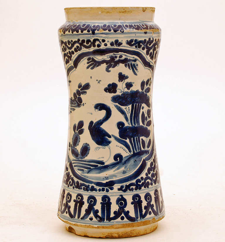 A very fine and rare 18th century talavera Poblana blue on white albarello (apothecary jar) with graphic foliate and geometric motifs in deep cobalt over a milk white slip. 

Dimensions: 10.5 inches vertical x 4.75 inches diameter. 

In overall