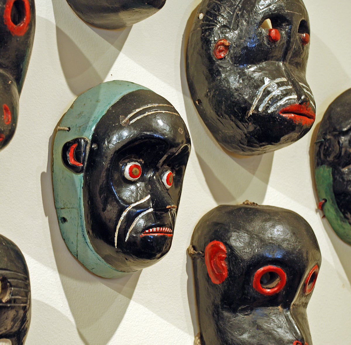 Superb Collection of 16 Antique Guatemalan Mico and Monkey Masks In Excellent Condition For Sale In San Francisco, CA