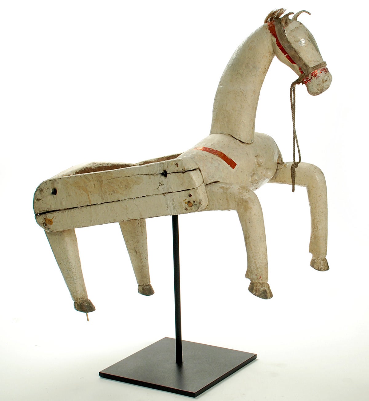 A great vintage Mexican 'Santiaguito' body mask with silver and red decals, horse hair mane and the original polychrome painted surface. Excellent wear and patina. Displayed on a high quality custom made stand.<br />
<br />
Dimensions: 25 inches