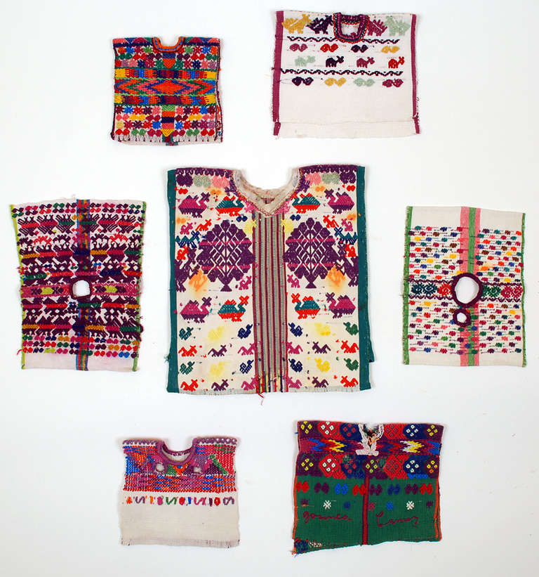 A collection of seven good mid 20th century Guatemalan saint's huipiles - all with elaborate cotton and silk brocades. 

In overall excellent condition. Some with minor soiling. 

Largest huipil measures approximately 11 inches x 9 inches