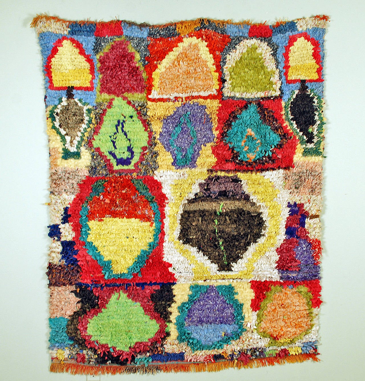 A good, graphic Moroccan boucherouite', also known as a 'rag rug', from the higher Middle and High Atlas mountain regions. Berber, circa 1980s.

The boucherouite is the product of the ever changing socio-economic conditions in Morocco's rural