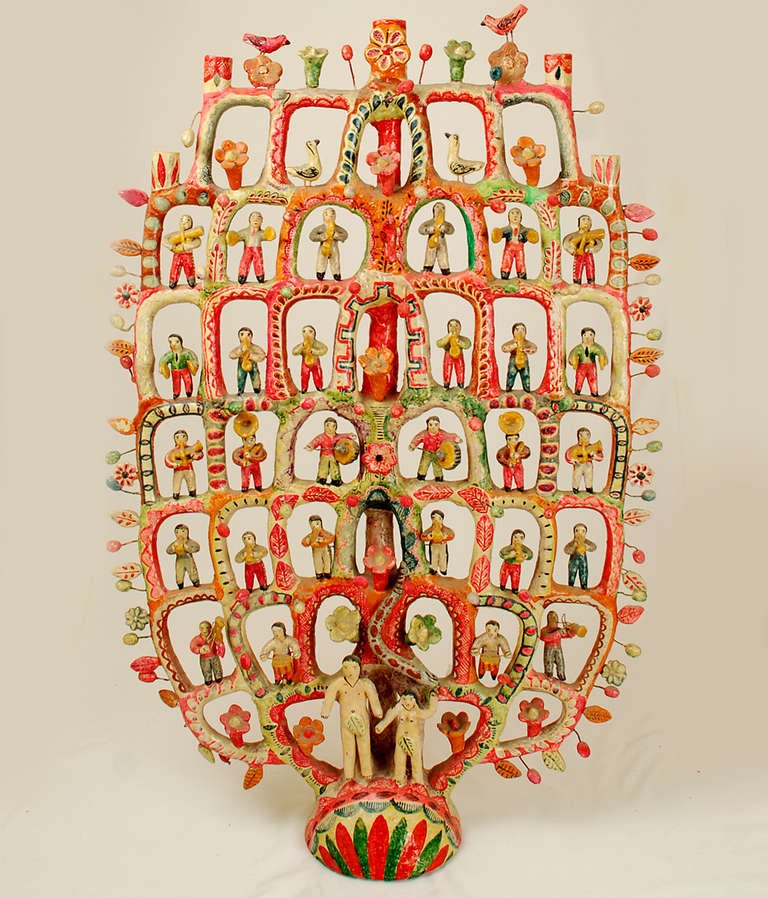 A Tree of Life masterpiece. This very large vintage Mexican ceramic tree of life candelabrum features Adam, Eve and the Serpent, surmounted by five armatures together with multiple rows of animals, dancers and musicians. Overall with excellent