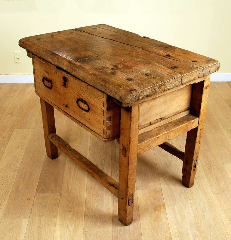 A good late 18th / early 19th century sabino wood side table with single timber top, large hanging drawer and four slightly splayed legs connected by a stretcher base. Mexico - circa 1800. Ex Claiborne Gallery, Santa Fe, NM. 

Dimensions: 41