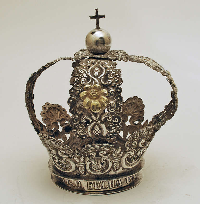 A large and impressive mid 19th century Spanish colonial gilt silver corona with beautiful foliate and scroll patterns surmounted by a silver ball and cross - dated, 1855. Condition: excellent
Dimensions: 10.5 inches high. Diameter is 8.75 inches.
