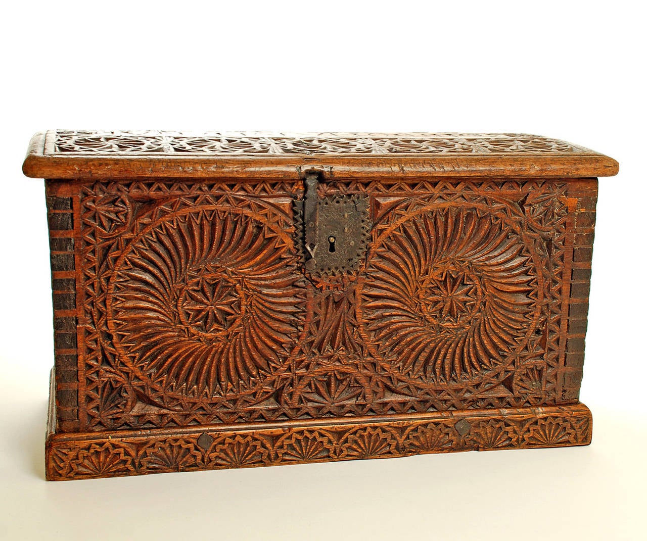 Extremely fine and rare 18th century Spanish Colonial six panel hand-carved cedar wood box. The front and side panels, connected by dovetail joints, are deeply carved in the Mudejar style with elaborate rosettes surrounded by geometric motifs. The