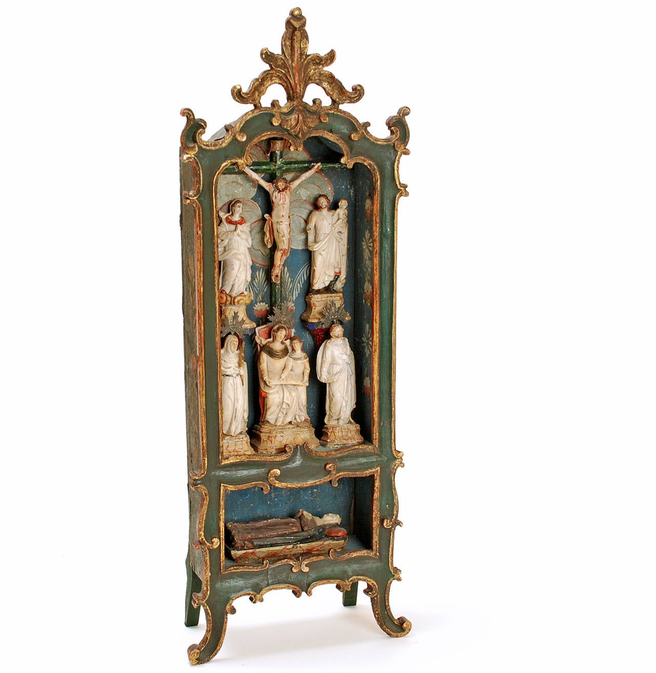 A very fine, rare late 18th century Portuguese colonial shrine from Brazil. Carved and polychrome painted wood with a 'Cristo' and various saints, each meticulously carved in piedra de huamanga -- a soft and pure form of alabaster that is mined in