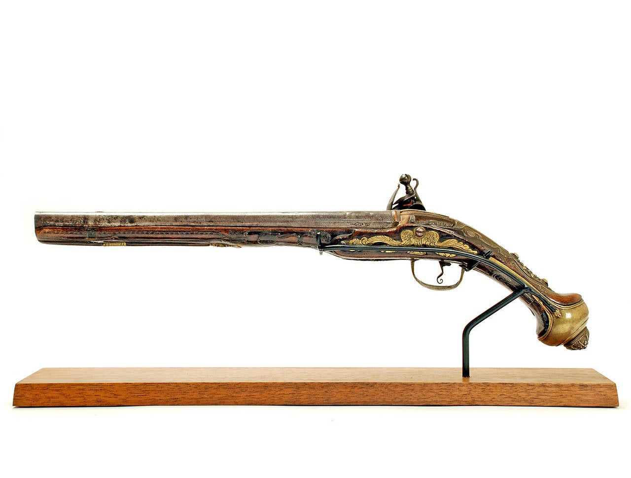 Outstanding early 19th century Ottoman flintlock pistol with various maker's marks in Arabic. Beautiful hand chased and engraved lock-plate. The stock with vertical bands of intricate silver inlay together with brass, bone and onyx decorations on