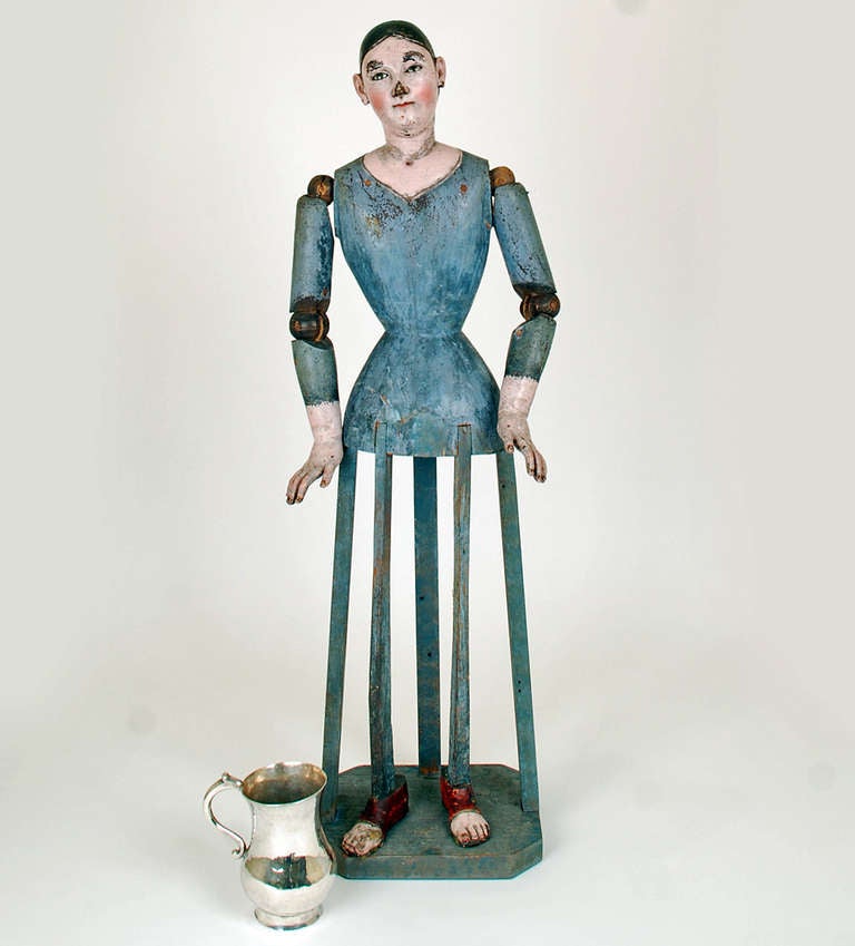 A superb mid 19th century bastidor (cage) santo with inset glass eyes, articulated arms - jointed at the elbow and shoulder, together with the original cage base. Overall with excellent wear and surface patina. In excellent, original condition. The