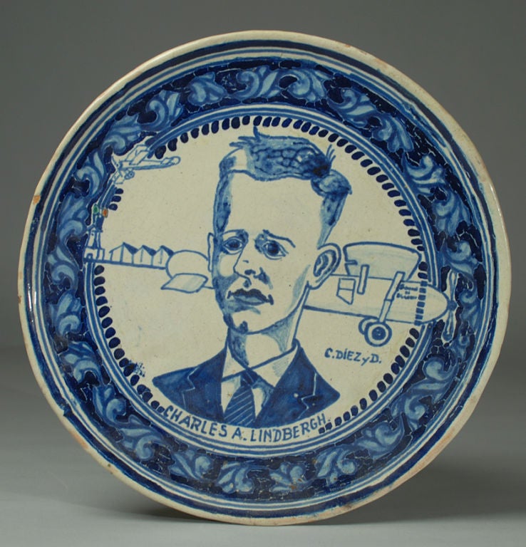 This exceedingly rare early 20th century Mexican talavera platter features the great American aviator, Charles Lindbergh with his single engine 'Spirit of St. Louis' in the background. Inscribed C. Diez y D and Charles a Lindbergh.<br