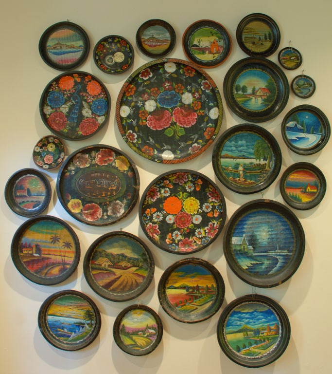 A collection of 24 colorful vintage Mexican hand carved and hand painted wooden bateas, all with various foliate, fishing and village scenes. Circa 1930's / 1940's.<br />
<br />
Dimensions: larges measures 23 inches diameter.<br />
<br