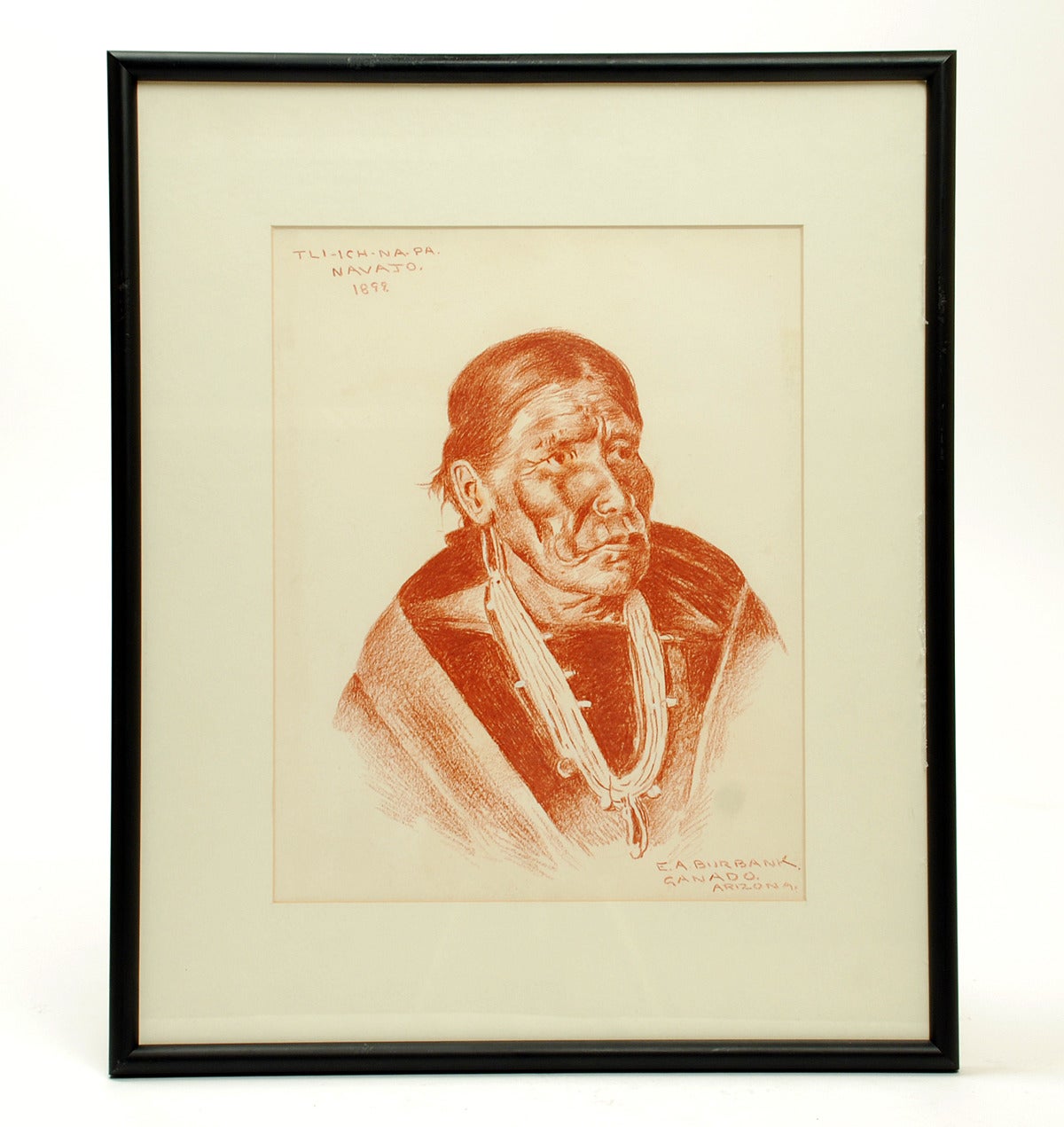 Rare original Conte crayon on paper of American Indian by well listed Taos and Santa Fe school painter Elbridge Ayer Burbank (1858-1949). Signed (lower right) and inscribed 'Tli-Ich-Na-Pa. / Navajo. / 1899.' and 'Ganado. Arizona.'

Dimensions: