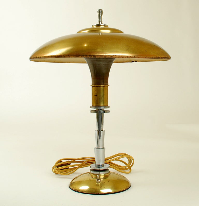 A Fine art Deco machine age 'Guardsman' brass table lamp made by the Faries Manufacturing Co., Decatur., IL and designed by Bert Dickerson. All original with 'normandie' bronze finish. Professionally rewired. Circa 1937.

Dimensions: 18 inches x