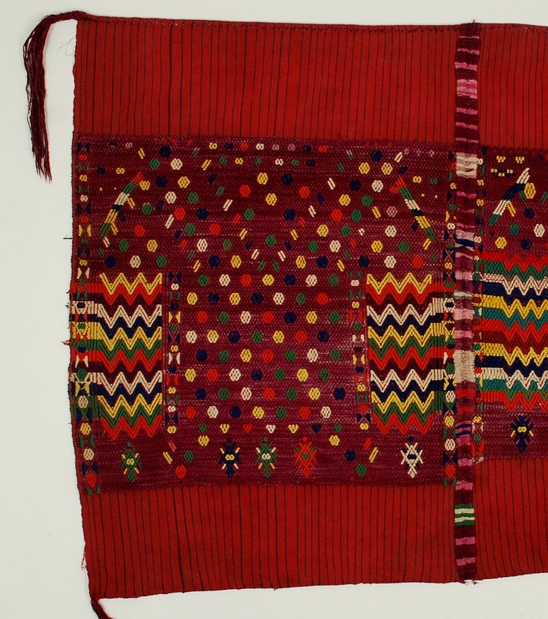 A superb early 20th century ceremonial tzute from Chichicastenango. Hand spun cotton with heavy silk brocades, silk tassels and a large, multi-colored silk randa down the middle.
Condition: in overall excellent, original condition