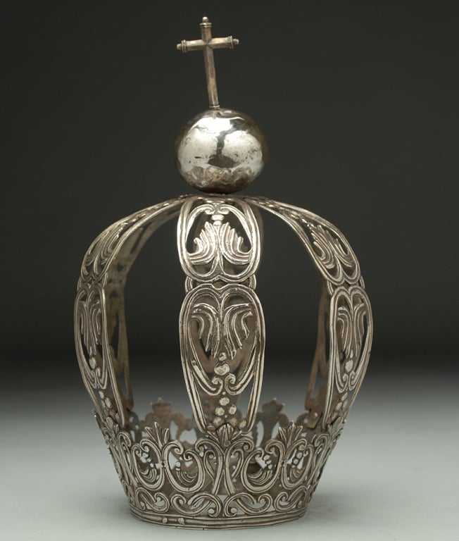 A fine, large 19th century colonial silver corona with beautiful foliate and scroll patterns surmounted by a silver ball and cross - circa 1840. <br />
<br />
Dimensions: 9.75 inches high. Base opening measures 3.6 inches diameter. <br />
<br