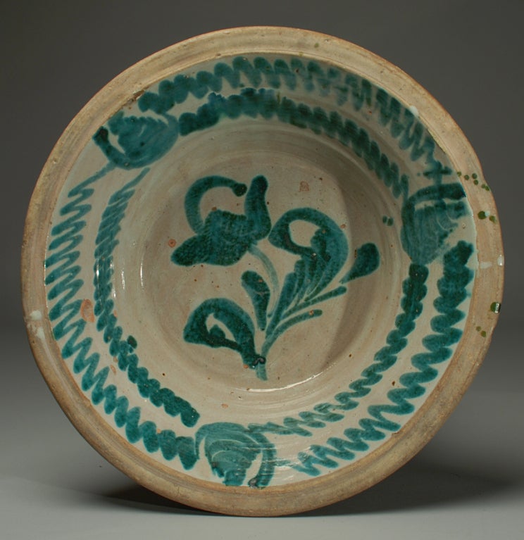 A large and impressive 19th century Spanish stoneware 'lebrillo' with beautiful 'morisco' green glaze over a milk white slip - Granada - circa 1860. The small Spanish blue on white plate is shown for scale only and is not part of this