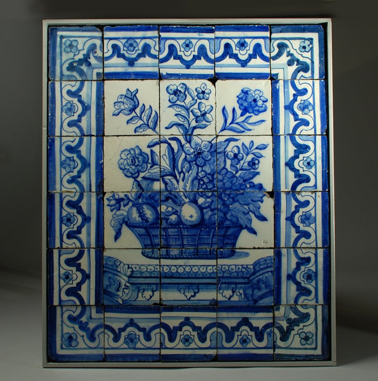 A rare 17th century Portuguese hand painted tile panel with 30 blue on white 'azulejos' - circa 1675. Mounted inside a handsome wood frame.

Dimensions 35 inches x 29