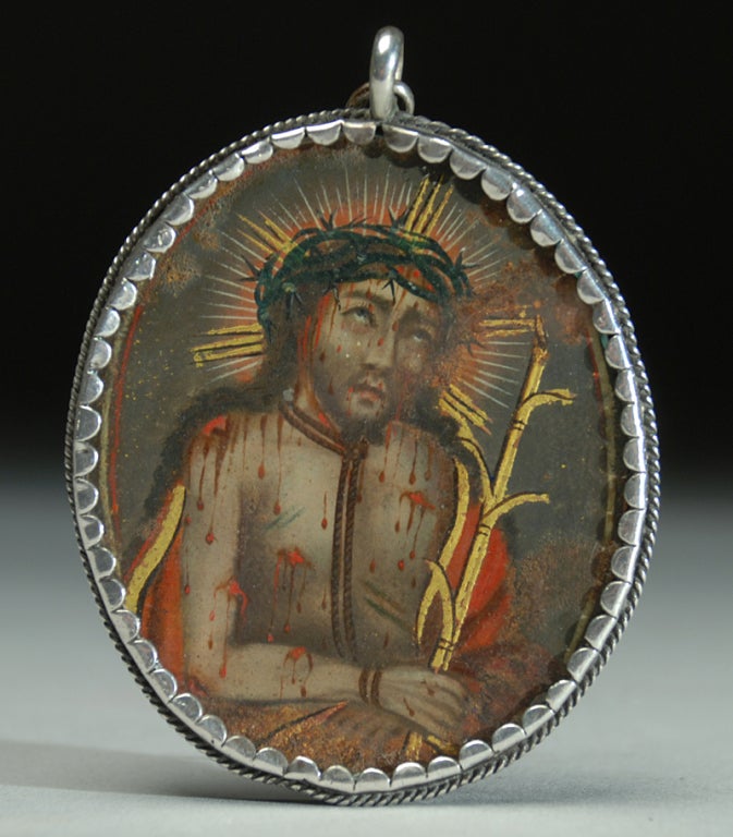 A beautiful 19th century double sided Andean relicario with 'Our Lord of the Labors' on the obverse face and 'Our Lady of Sorrows' on the reverse. Overall, finely detailed with iridescent gold paint throughout. Displayed behind glass in the original