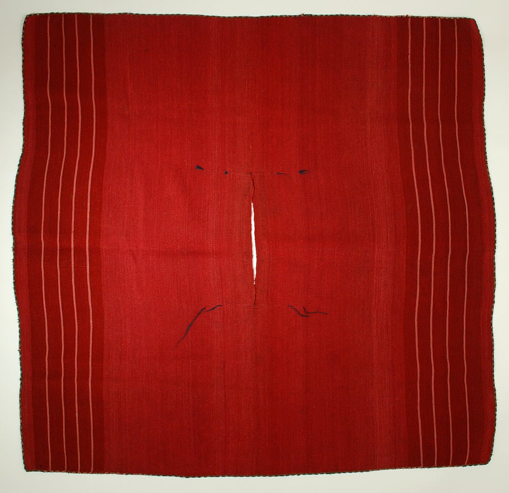 Rare late 19th century Ccahua man's ceremonial ponchito - Department of Oruro, Bolivia. All natural dyes with beautifully abrashed red, original hand wrapped selvages and small tassels surrounding the opening. In excellent, original condition.