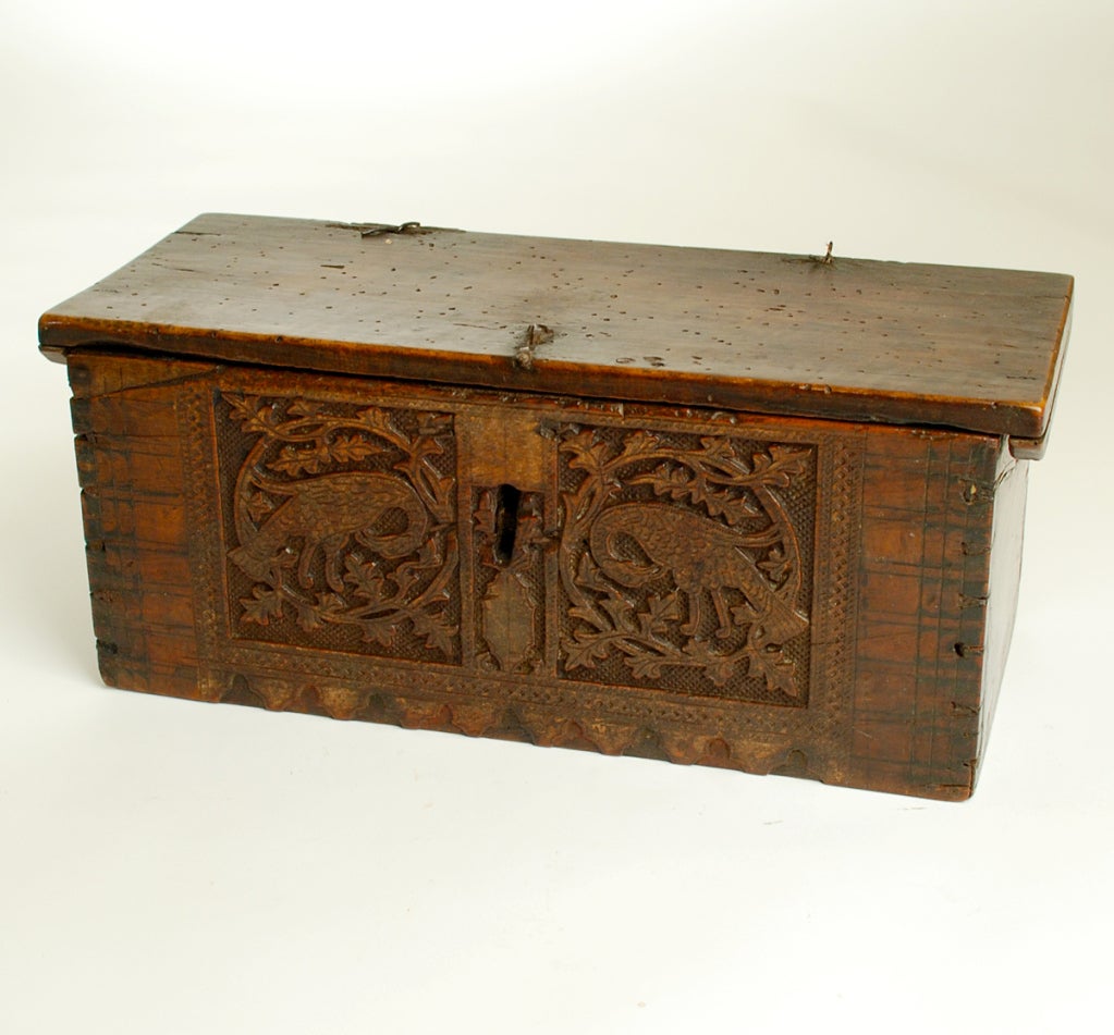 Exceedingly fine and rare 17th century Spanish coffret in the 'Mudejar' style with stippling, deeply carved foliate motifs, playful rabbits and geometric motifs. Finely carved dovetail joinery with original pin hinges. The silver cup is shown for